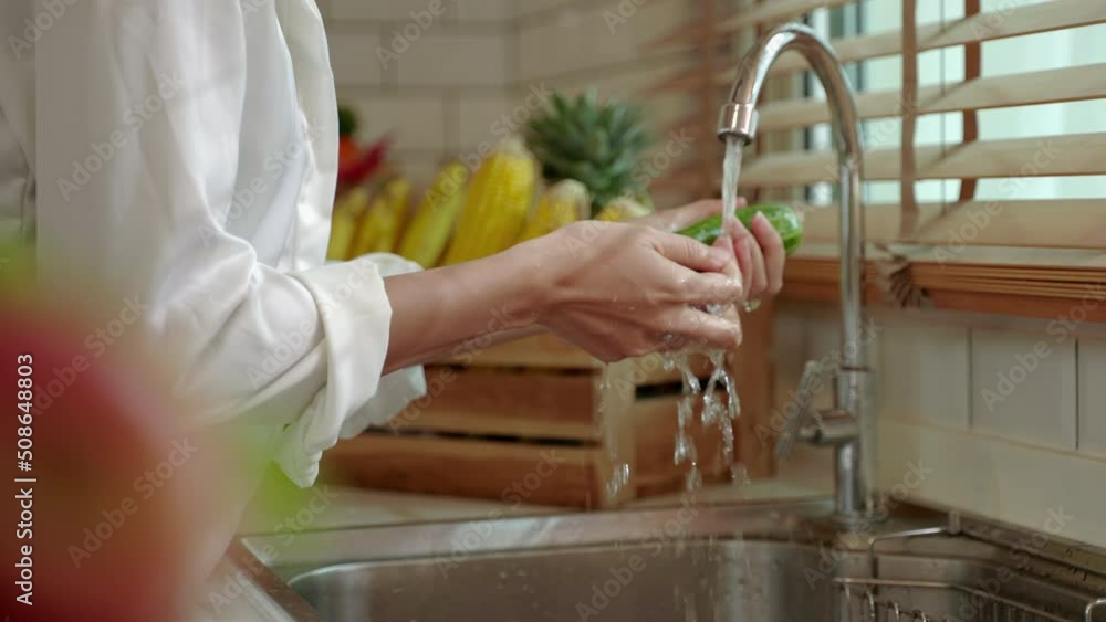 Asian woman washing vegetables in home kitchen, healthy eating and wellness concept, happiness at home
Asian woman washing vegetables in home kitchen, healthy eating and wellness concept, happiness at home