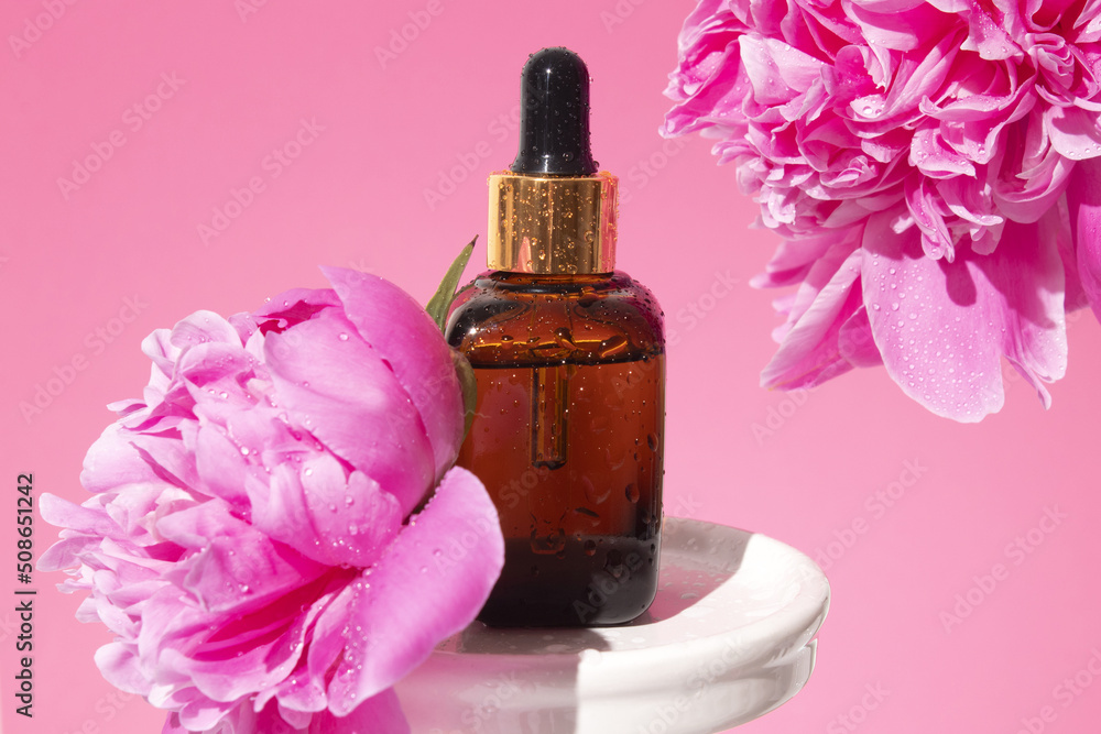Cosmetic amber glass bottle with dropper on podium. Hyaluronic acid oil, serum with collagen and peptides skin care product. Mockup packaging, cosmetic design branding Cosmetic amber glass bottle with dropper on podium. Hyaluronic acid oil, serum with collagen and peptides skin care product. Mockup packaging, cosmetic design branding