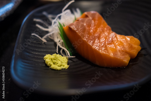Raw salmon slice or salmon sashimi in Japanese style