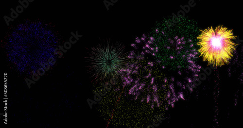 Image of colourful christmas and new year fireworks exploding in night sky