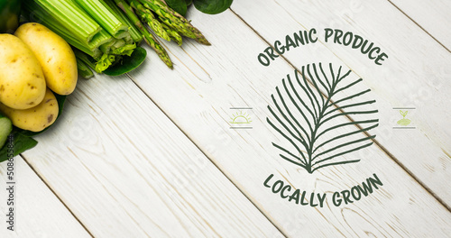 Image of organic produce text in green over fresh organic vegetables on wooden boards