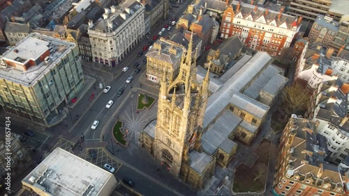 Aerial arc shot of St  Nicholas Cathedral, Newcastle, UK (4K) photo