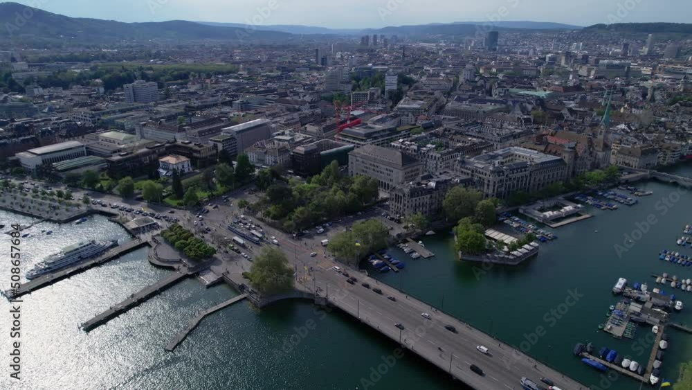 Drone flying above the Limmat River in Old Town Zurich with beautiful city aerial views. Drone flying above the Limmat River in Old Town Zurich with beautiful city aerial views.