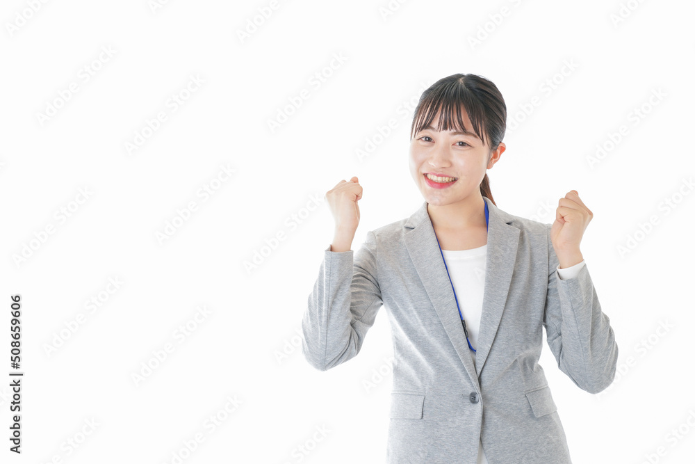 ガッツポーズをする若いキャリアウーマン