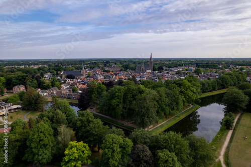 Aerial view of historic Dutch city Groenlo with church tower rising above the authentic medieval rooftops and defending moat in the foreground