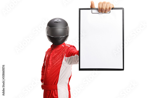 Motorsport racer with a helmet holding a clipboard with a blank document © Ljupco Smokovski