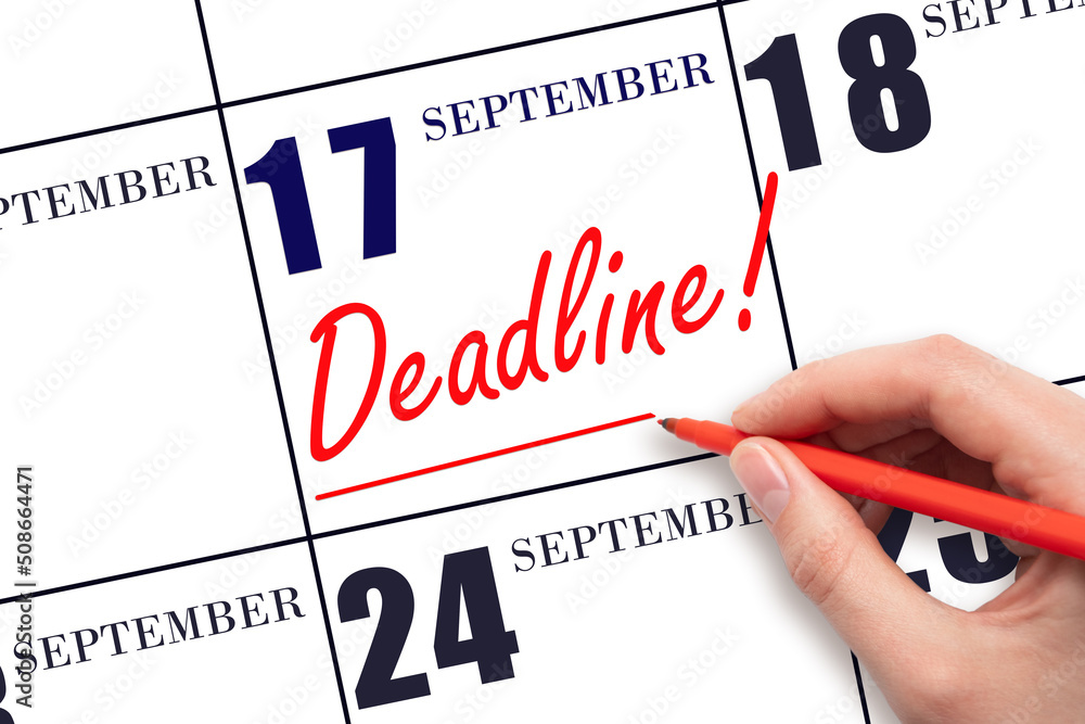 Hand drawing red line and writing the text Deadline on calendar date September 17. Deadline word written on calendar Hand drawing red line and writing the text Deadline on calendar date September 17. Deadline word written on calendar