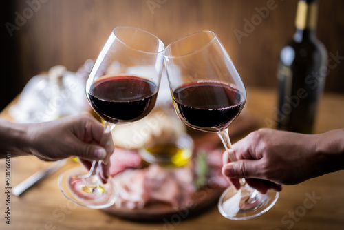 italian antipasto plate with glass of red wine