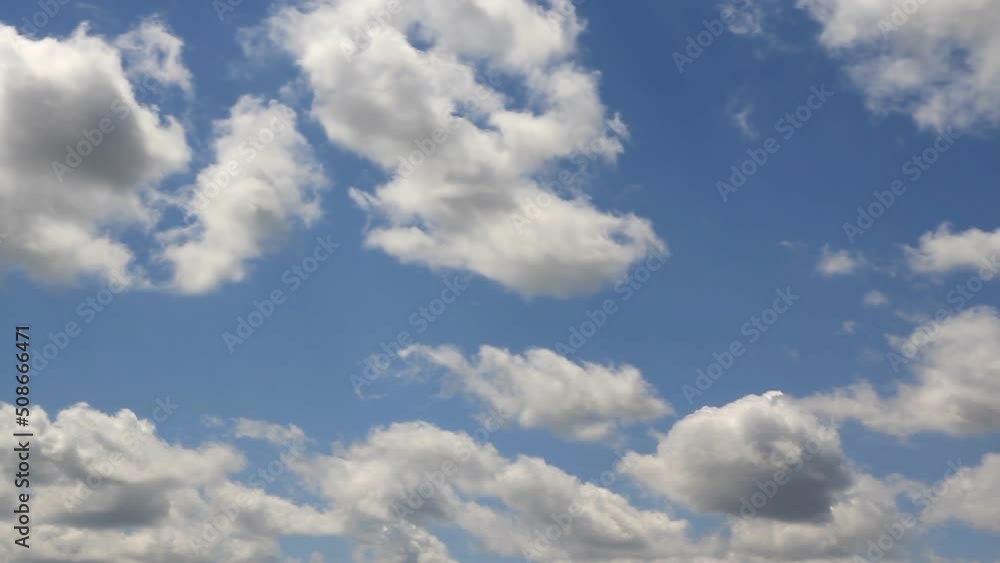 Rapid movement of white clouds. Timelapse of fast moving clouds. Fast moving and changing shape of clouds against a blue sky Rapid movement of white clouds. Timelapse of fast moving clouds. Fast moving and changing shape of clouds against a blue sky