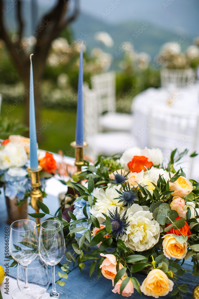 Bouquets of flowers in vase on the wedding table