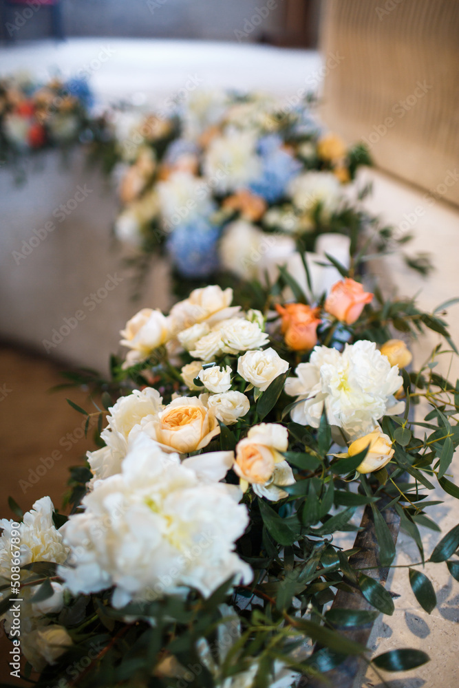 Bouquets of flowers in vase on the wedding table
