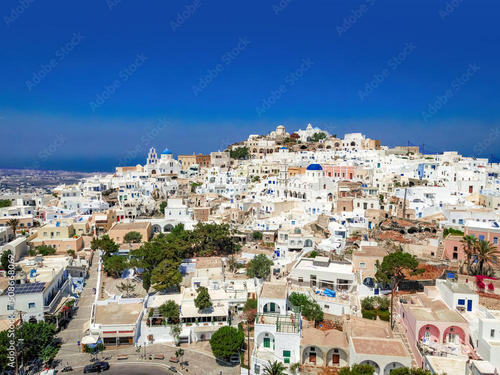 Top view of classic Greek architecture - white houses under the hot sun