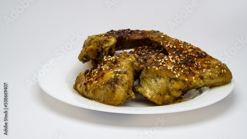 appetizing chicken wings on a white plate