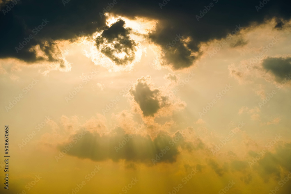 Golden clouds with sun rays