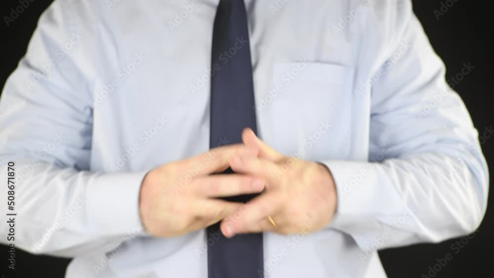 Man cracking the knuckles of his hands and fingers (knuckle-cracking or knuckle joints) Man cracking the knuckles of his hands and fingers (knuckle-cracking or knuckle joints)