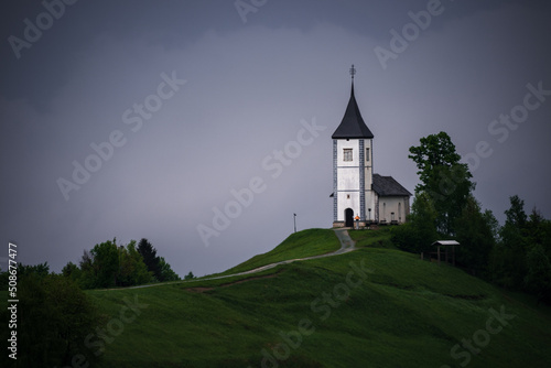 Jamnik church on top of the hill on a moody and stormy day after the rain.