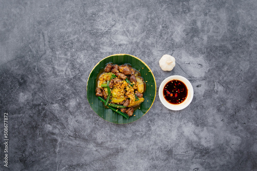 stir fried chicken heart and lungs with fish sauce served in bowl isolated on dark grey background top view of japanese food