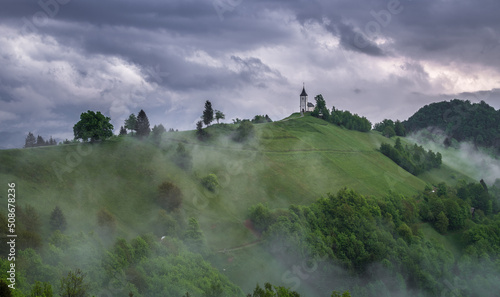 Jamnik church on top of the hill on a moody and stormy day after the rain.