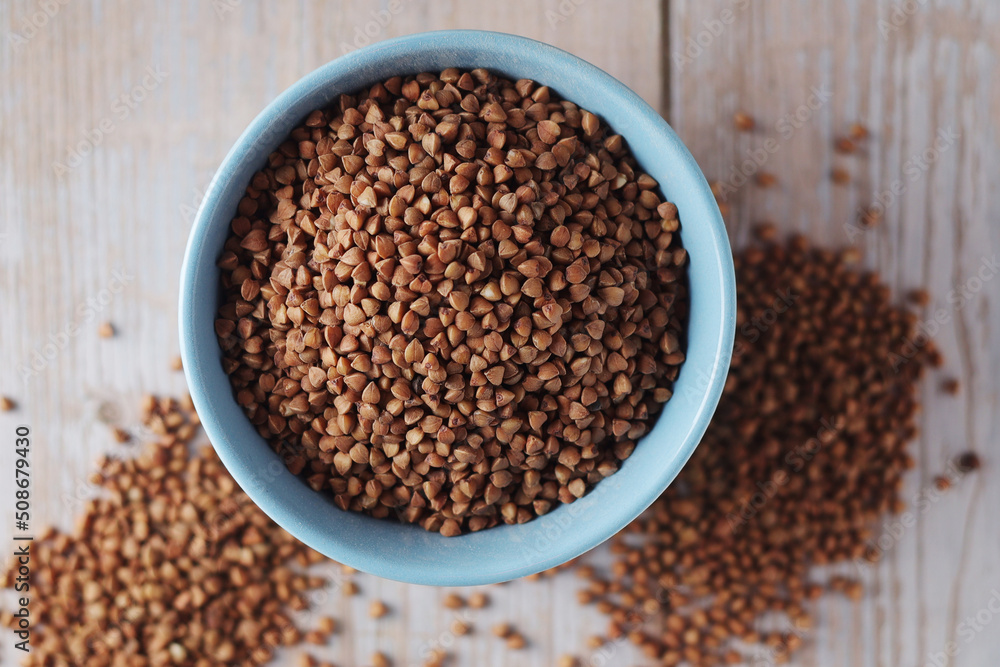 Buckwheat grain in a small ceramic bowl Buckwheat grain in a small ceramic bowl