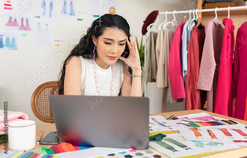 young asian designer woman stress working design creative while sitting at office studio. work from home concept.