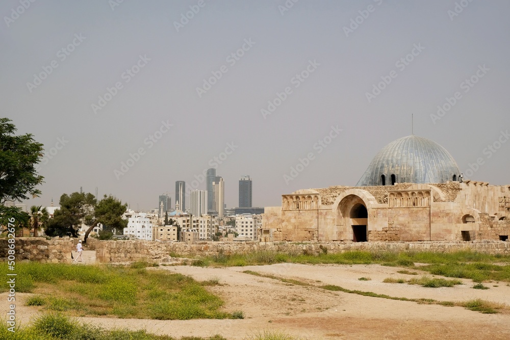 Ummayad Palace in Citadel Jebel Al Qala'a and panorama of modern city in background in Amman, Jordan. 