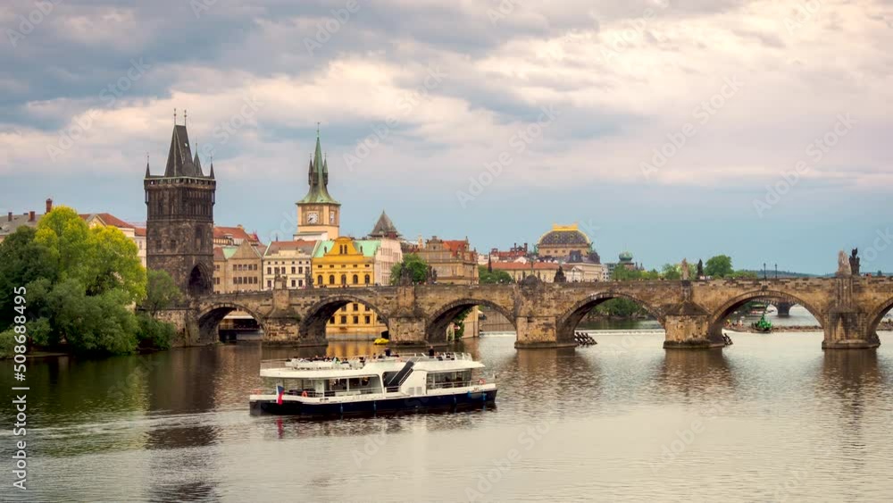 Evening Time-lapse of Charles Bridge Reflecting in the Vltava River, a Famous Cultural Monument in Prague Evening Time-lapse of Charles Bridge Reflecting in the Vltava River, a Famous Cultural Monument in Prague