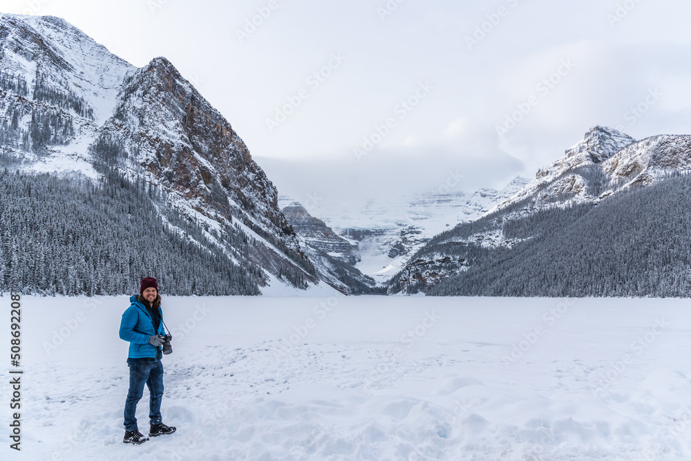 Tourist taking photos in winter season at Lake Louise, Alberta, Canada. 