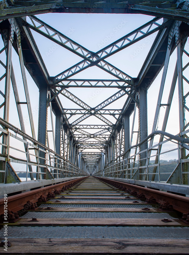 An old abandoned railway bridge during the sunset An old abandoned railway bridge during the sunset