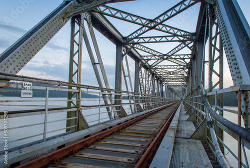 An old abandoned railway bridge during the sunset