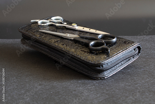  hairdressing tool on a black background, strong plan
