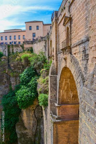 View of the famous stone bridge "Puente Romano" over the gorge. © Delia_Suvari