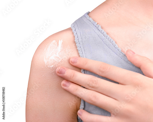 A girl applying sunscreen isolated on white background.Skincare concept.