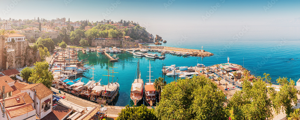 Fototapeta premium Aerial view of the picturesque bay with marina port with yachts near the old town of Kaleici in Antalya. Turkish Riviera and resort paradise
