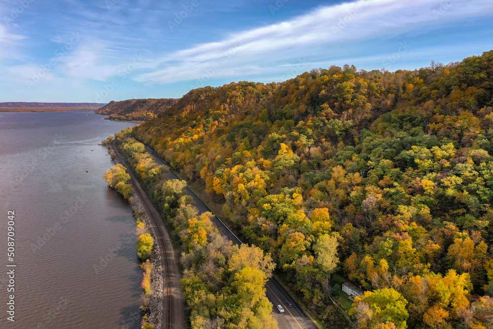 Railroad and Road Wind Past Autumn Riverside Bluff Railroad and Road Wind Past Autumn Riverside Bluff