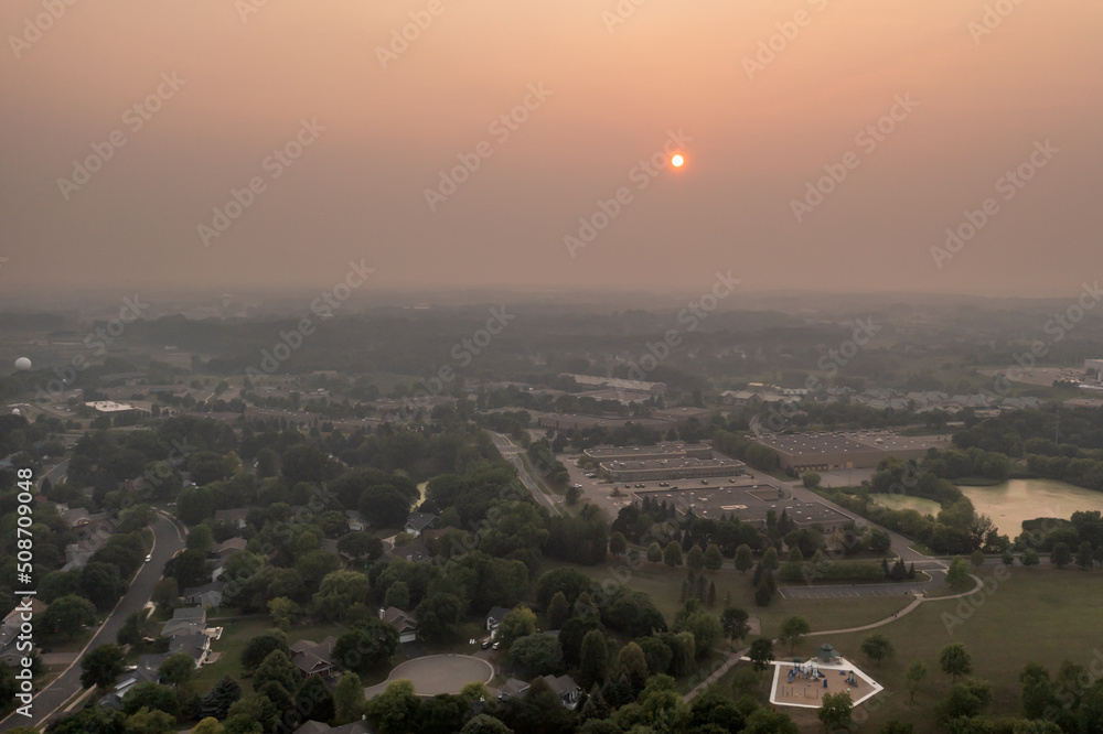 Obraz premium Smoke From Wildfires Obscures the View Over Suburbs
