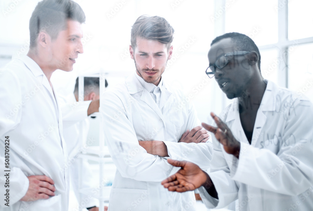 background image is a group of scientists microbiologists. background image is a group of scientists microbiologists.
