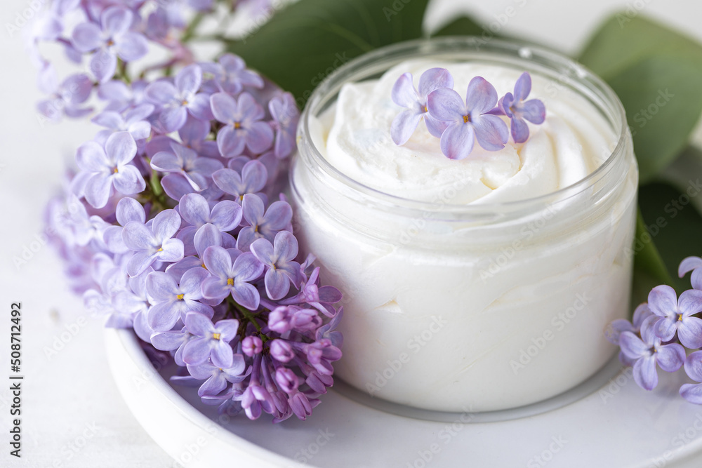Concept of pure natural organic plant-based ingredients in cosmetology, herbal and flower extract. Lilac for anti-age and anti-acne therapy, gentle face and body skin care Concept of pure natural organic plant-based ingredients in cosmetology, herbal and flower extract. Lilac for anti-age and anti-acne therapy, gentle face and body skin care