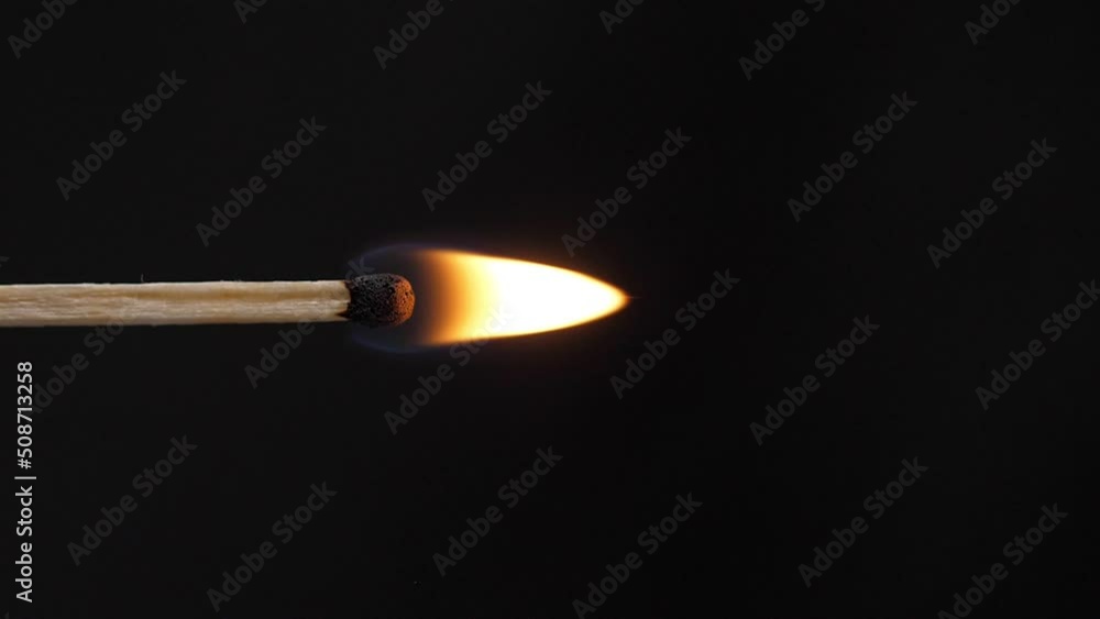 Light a match in the dark, closeup. Strike a matchstick. Vertical video Light a match in the dark, closeup. Strike a matchstick. Vertical video