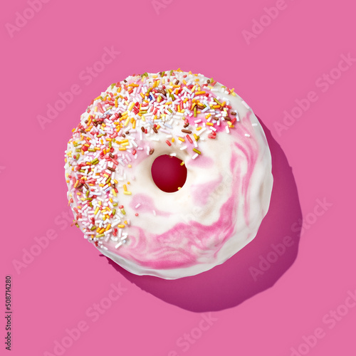 Fototapeta pink donut with glaze on pink pastel background