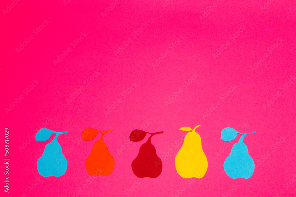 colorful pears at the bottom of a pink background above an empty copy space, creative summer fruits design, minimal concept colorful pears at the bottom of a pink background above an empty copy space, creative summer fruits design, minimal concept