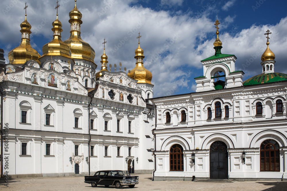 Vintage car stands near the Orthodox Church