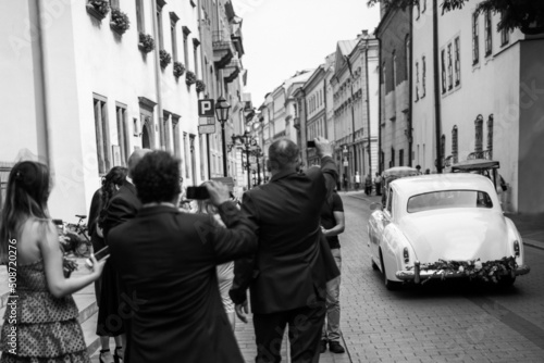 The bride and groom leave by car