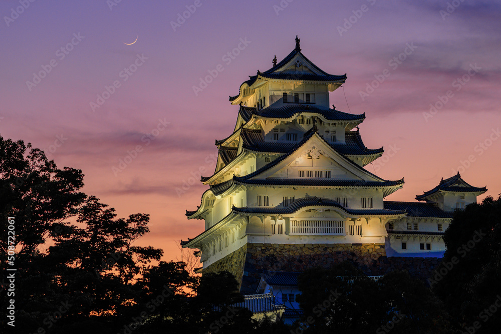 Crescent moon and sunset colors over Himeji Castle Crescent moon and sunset colors over Himeji Castle