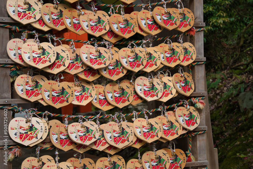Many hangings of wooden plaques called Ema.   Kyoto Japan
