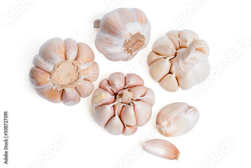 Top view Fresh peeled garlic cloves, bulb with garlic slices isolated on white background