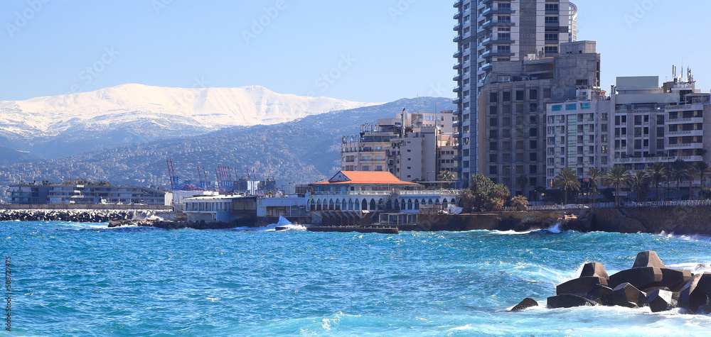 Fototapeta premium Panoramic view of the Beirut skyline with snow-covered Mt Sannine in the background