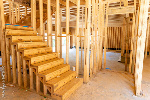 New house residential construction framing with stairs.