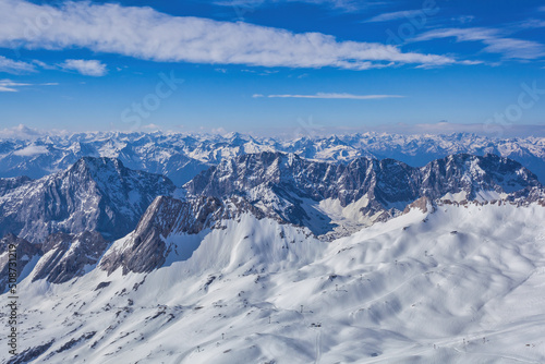 Garmisch Partenkirchen Germany, Zugspitze peak and Alps mountain range with snow in winter season © Noppasinw
