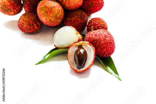 Fresh lychee fruits (Litchi) with leaves isolated on white background photo