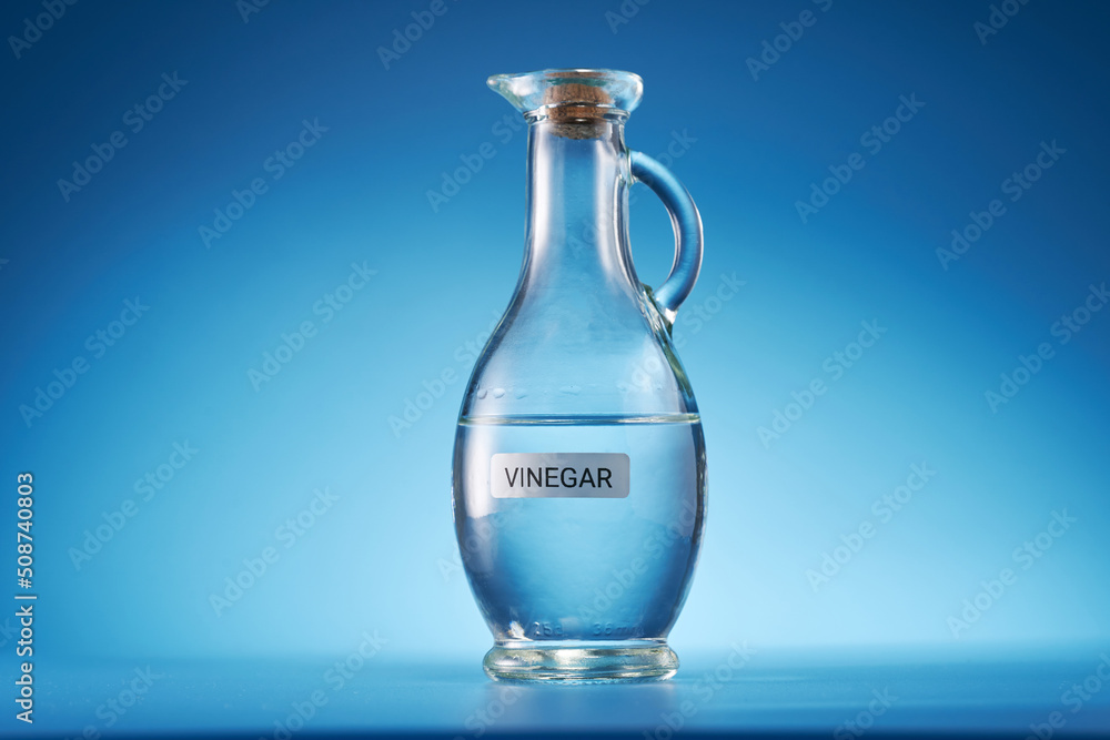 white vinegar against blue background white vinegar against blue background